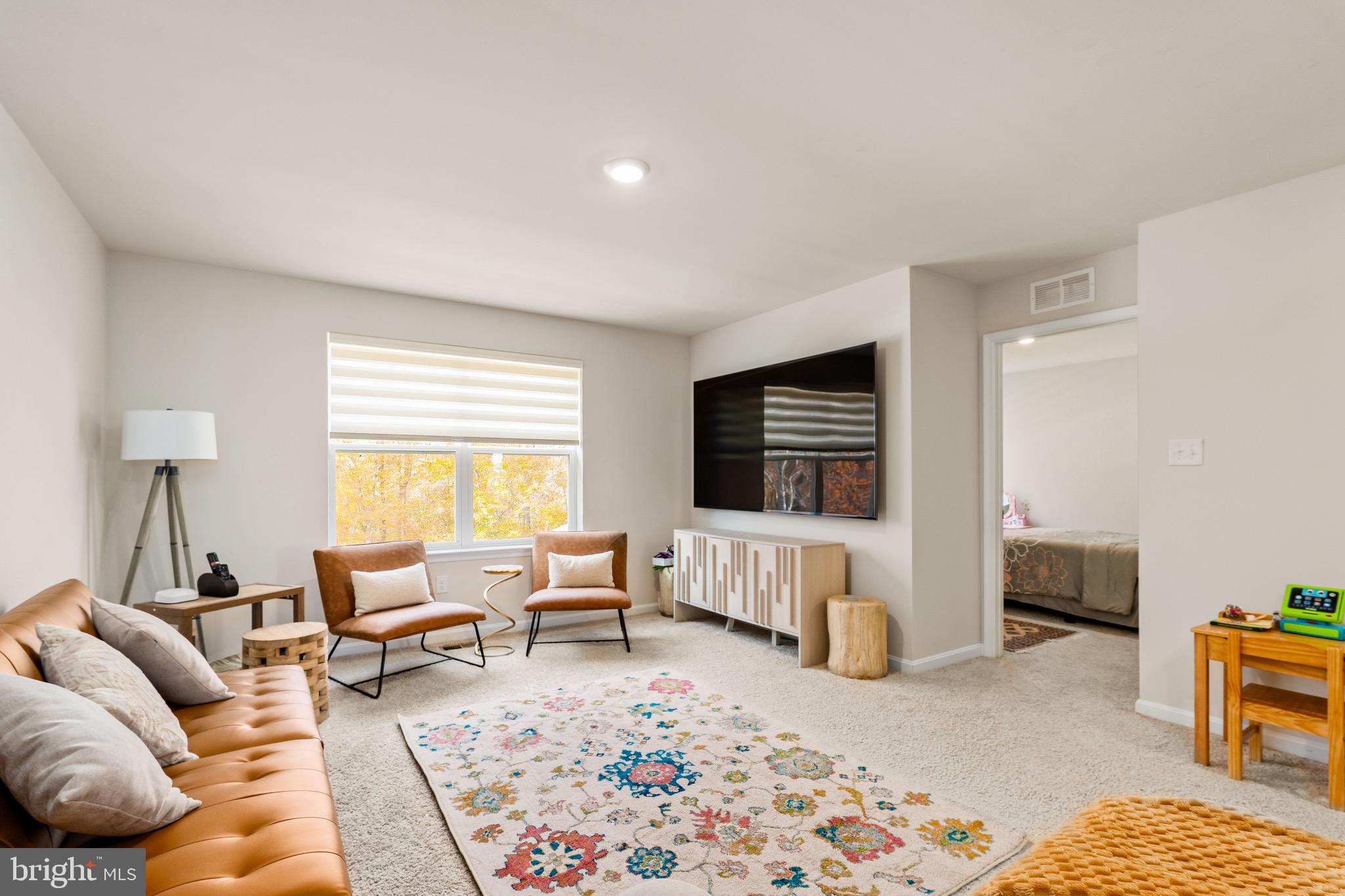 1268 Pimpernell Path Middletown, DE 19709 - Photo 20 of 51 a living room with furniture or couch and a flat screen tv