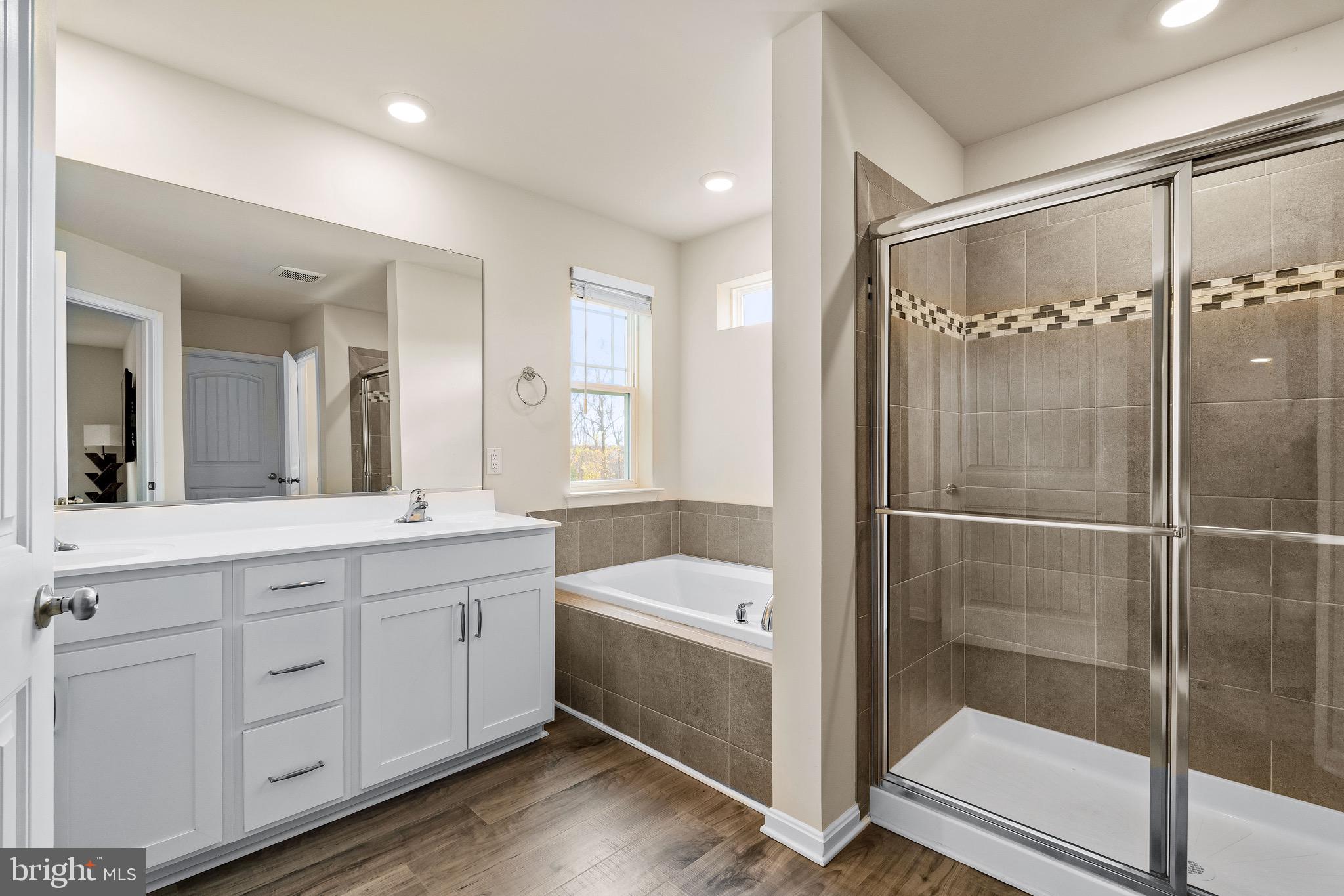 1268 Pimpernell Path Middletown, DE 19709 - Photo 24 of 51 a bathroom with a tub shower and sink