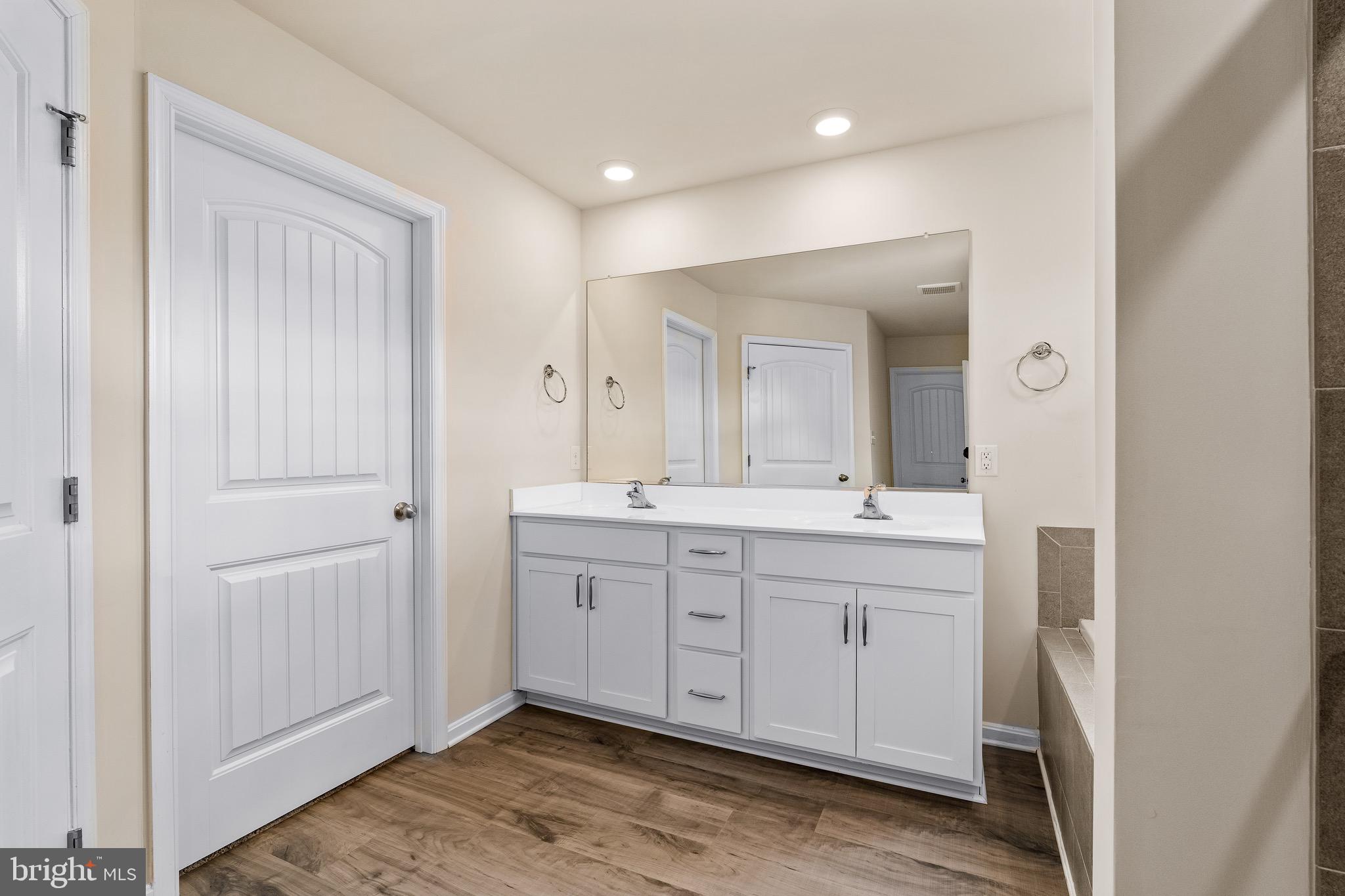 1268 Pimpernell Path Middletown, DE 19709 - Photo 25 of 51 a spacious bathroom with a mirror and a sink