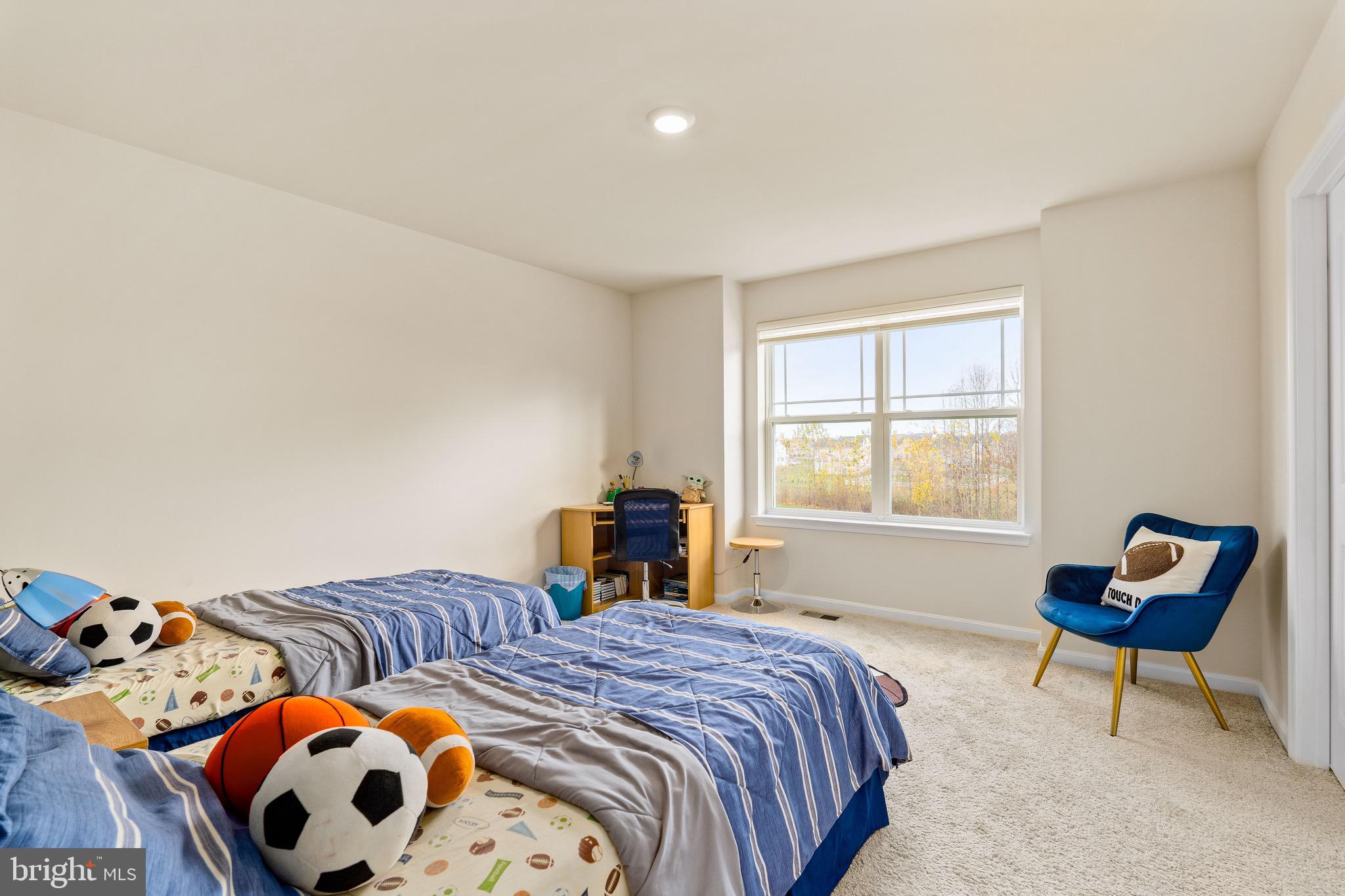 1268 Pimpernell Path Middletown, DE 19709 - Photo 28 of 51 a bedroom with a bed and a window