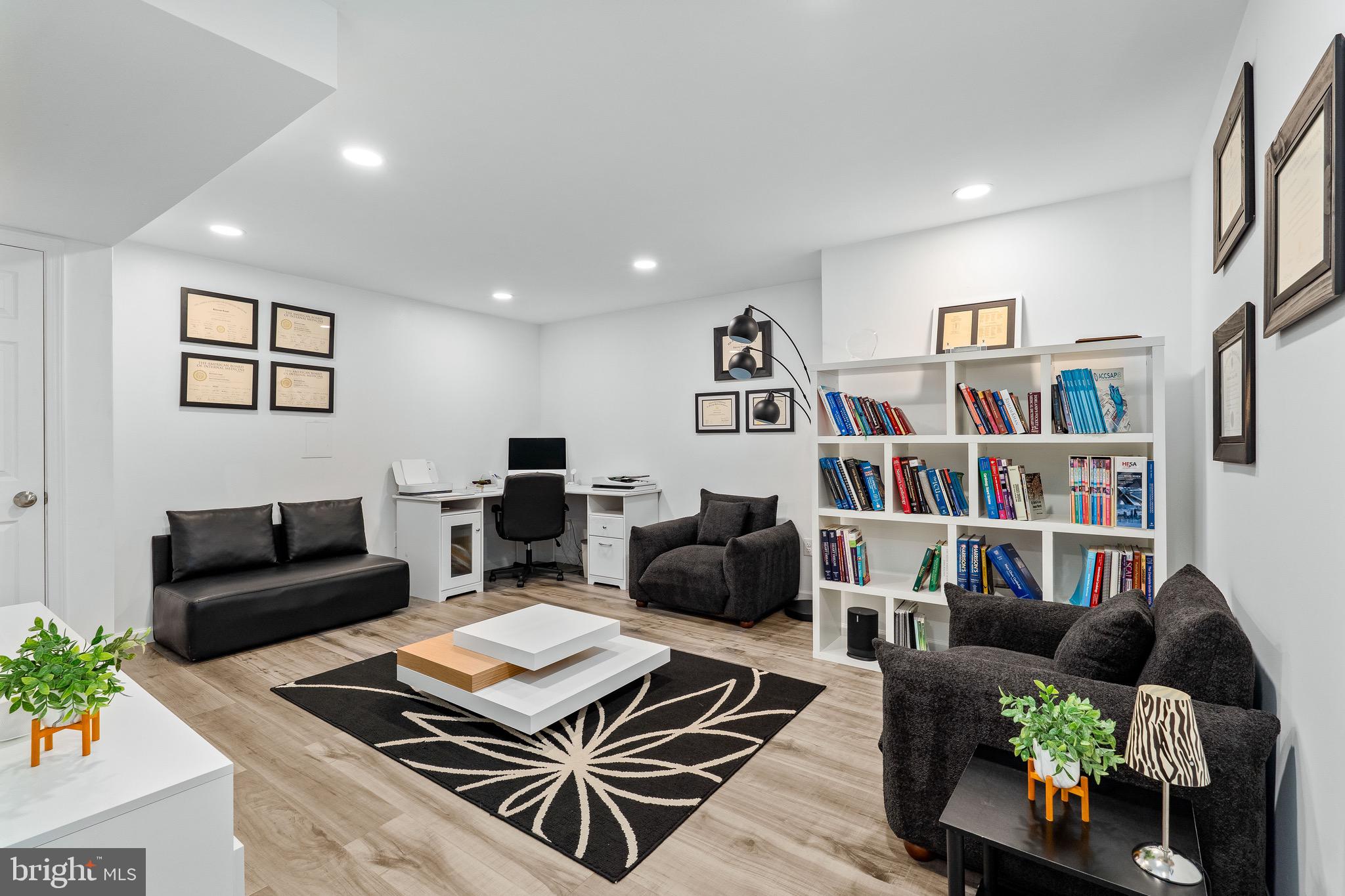 1268 Pimpernell Path Middletown, DE 19709 - Photo 36 of 51 a living room with furniture and a book shelf