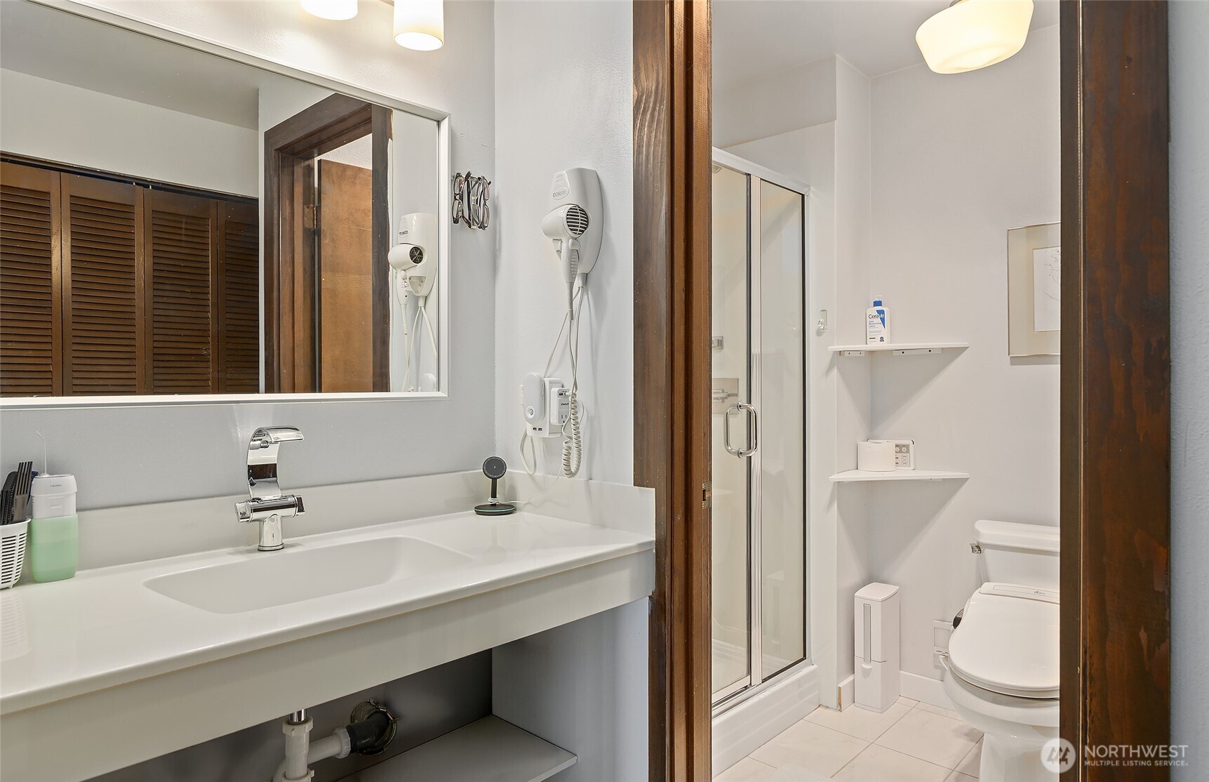 135 North 46th Street, Unit 101 Seattle, WA 98103 - Photo 13 of 30 a bathroom with a sink a toilet and shower