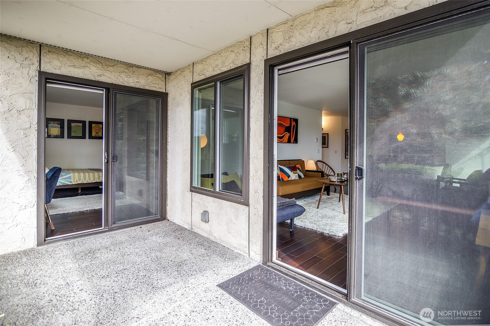 135 North 46th Street, Unit 101 Seattle, WA 98103 - Photo 14 of 30 a view of a hallway to a livingroom and a hall with wooden floor