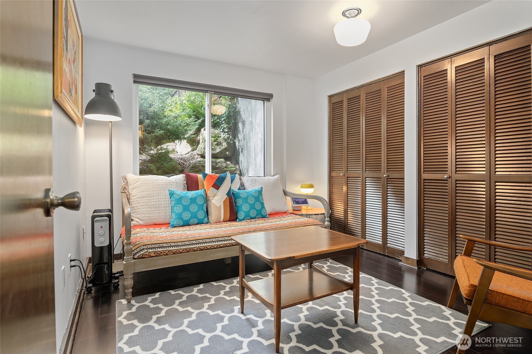 135 North 46th Street, Unit 101 Seattle, WA 98103 - Photo 16 of 30 a living room with furniture and a floor to ceiling window