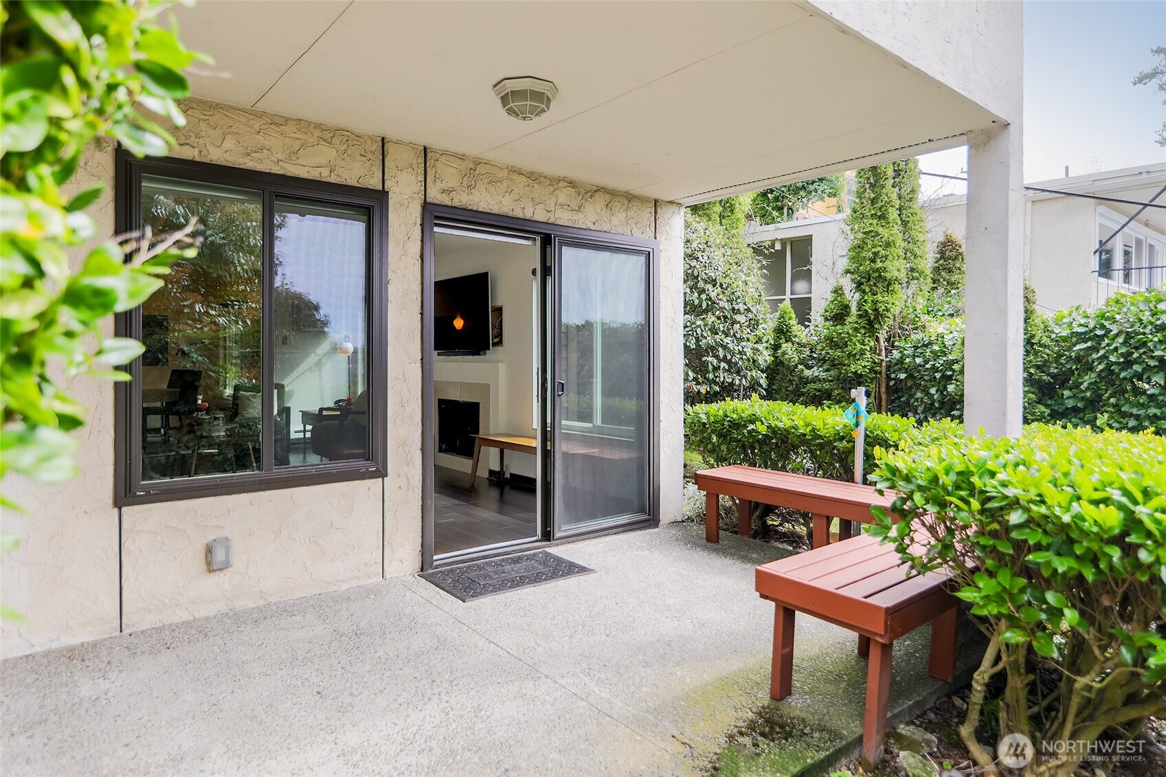 135 North 46th Street, Unit 101 Seattle, WA 98103 - Photo 2 of 30 a room with furniture and a potted plant
