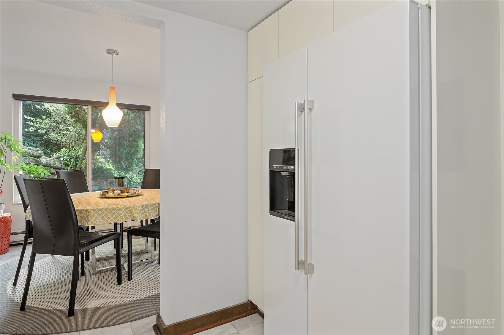 135 North 46th Street, Unit 101 Seattle, WA 98103 - Photo 22 of 30 a view of a dining room with furniture window and outside view