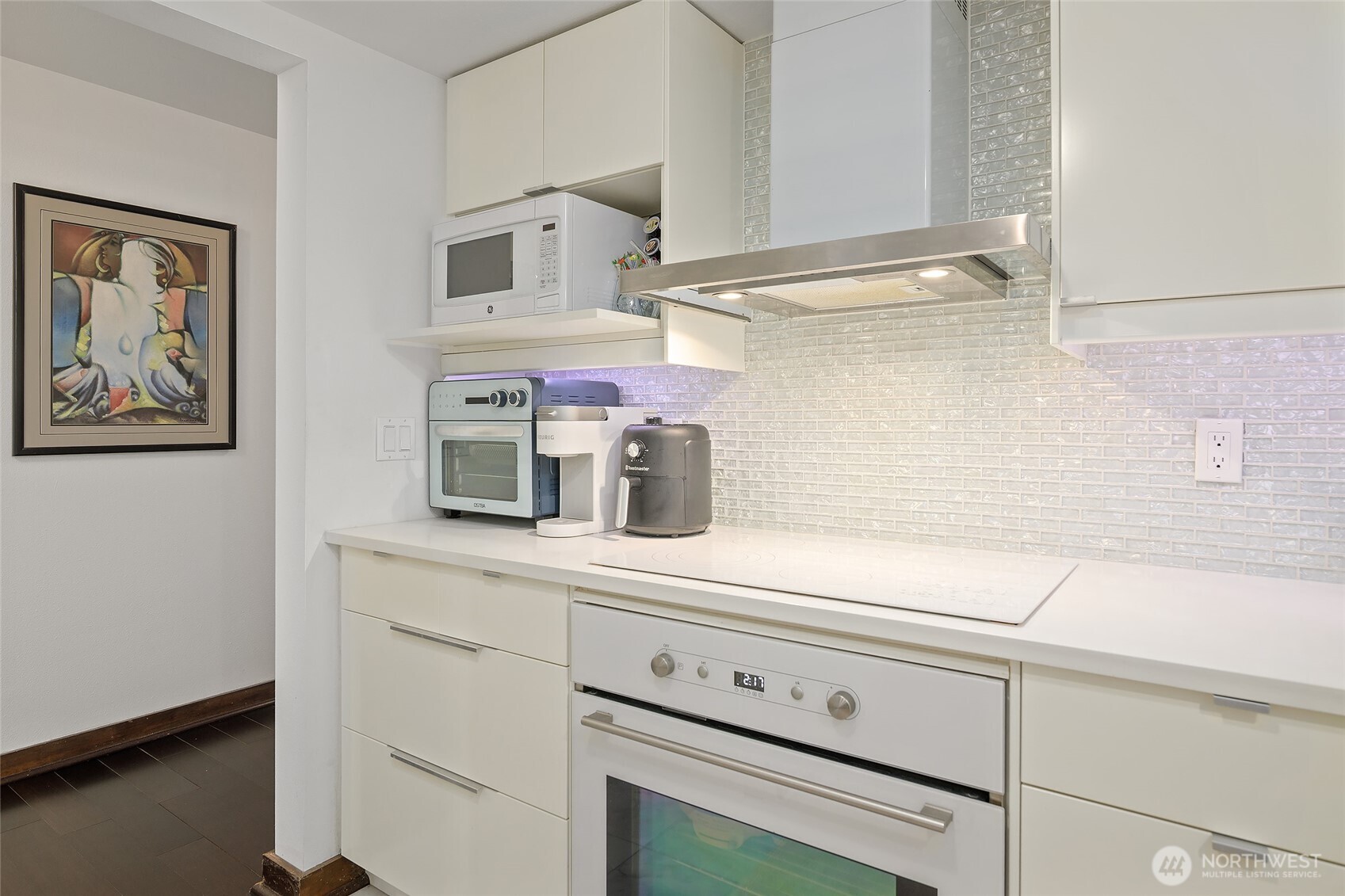 135 North 46th Street, Unit 101 Seattle, WA 98103 - Photo 6 of 30 a kitchen with a sink and cabinets