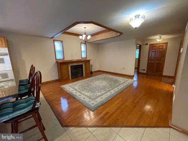 a view of a livingroom with furniture and a fireplace