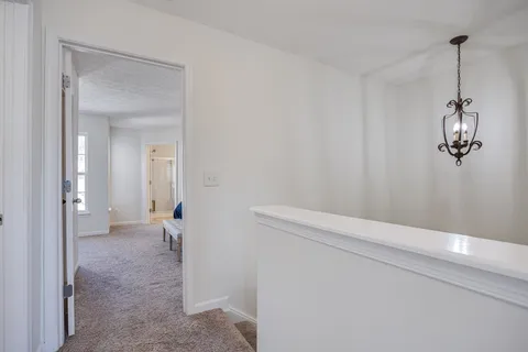 a bedroom with bed and window