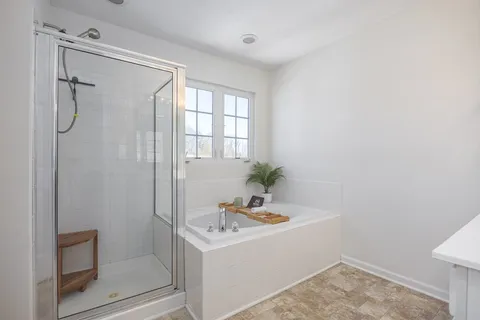 a bathroom with a sink a vanity and a window