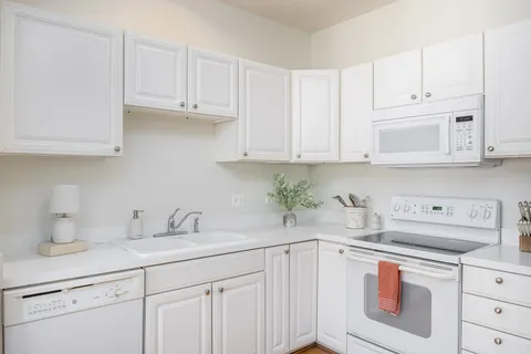 a bathroom with a double vanity sink mirror and