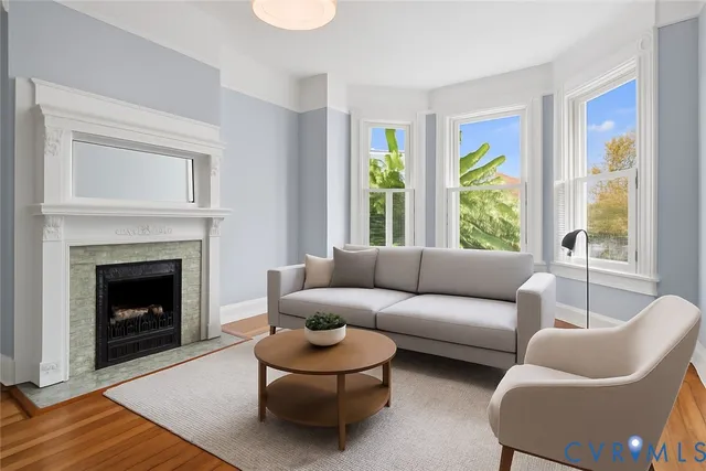 a living room with furniture and a fireplace