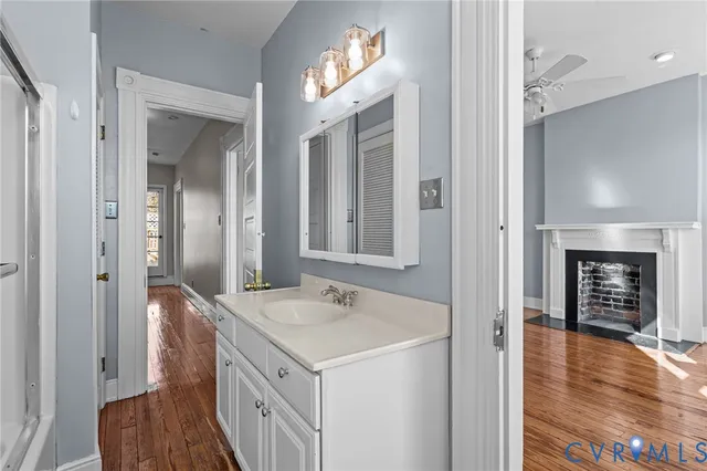 a spacious bathroom with a sink and a mirror