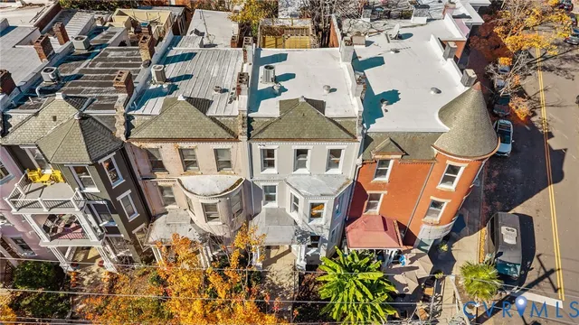an aerial view of a house with swimming pool and sitting space
