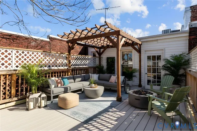 a view of a patio with dining table and chairs