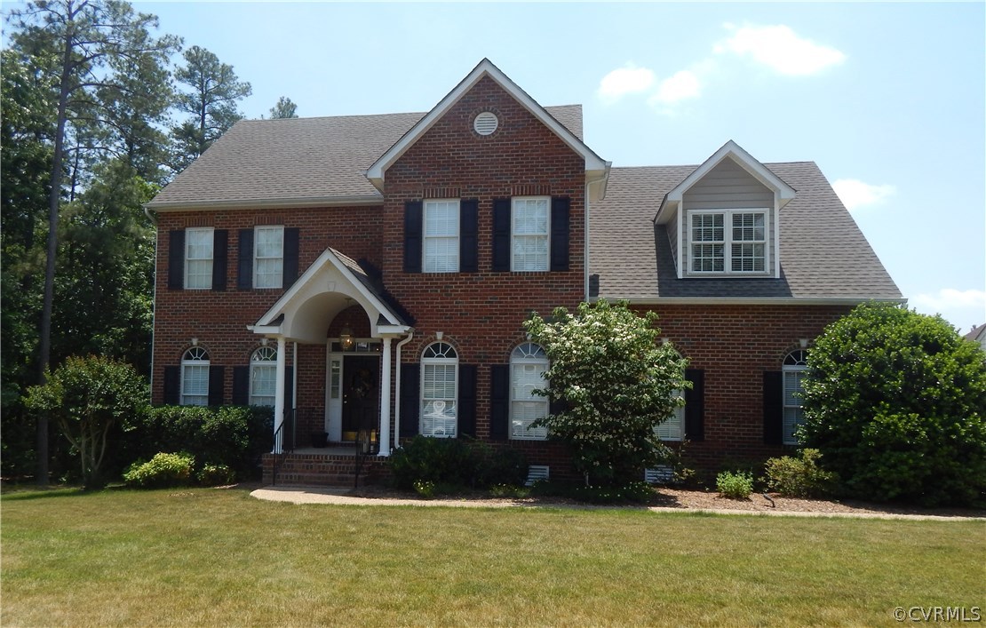 1737 Rolfield Way Henrico, VA 23238 - Photo 1 of 16 a front view of a house with a yard and garage