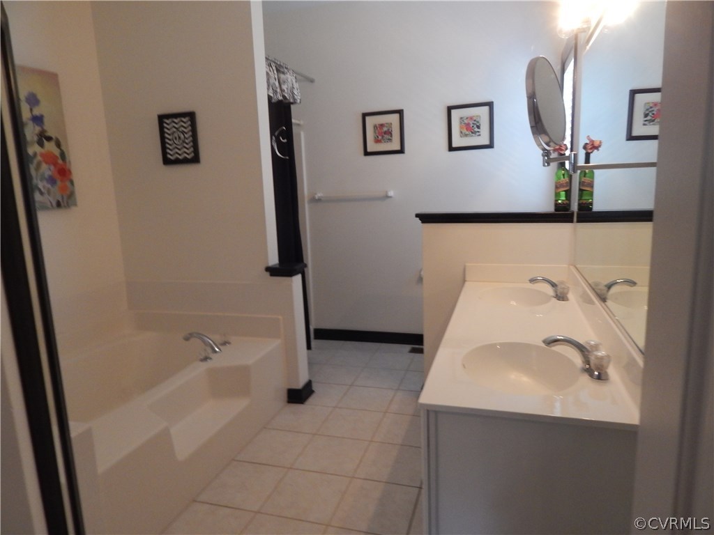 1737 Rolfield Way Henrico, VA 23238 - Photo 13 of 16 a bathroom with a bathtub and a sink