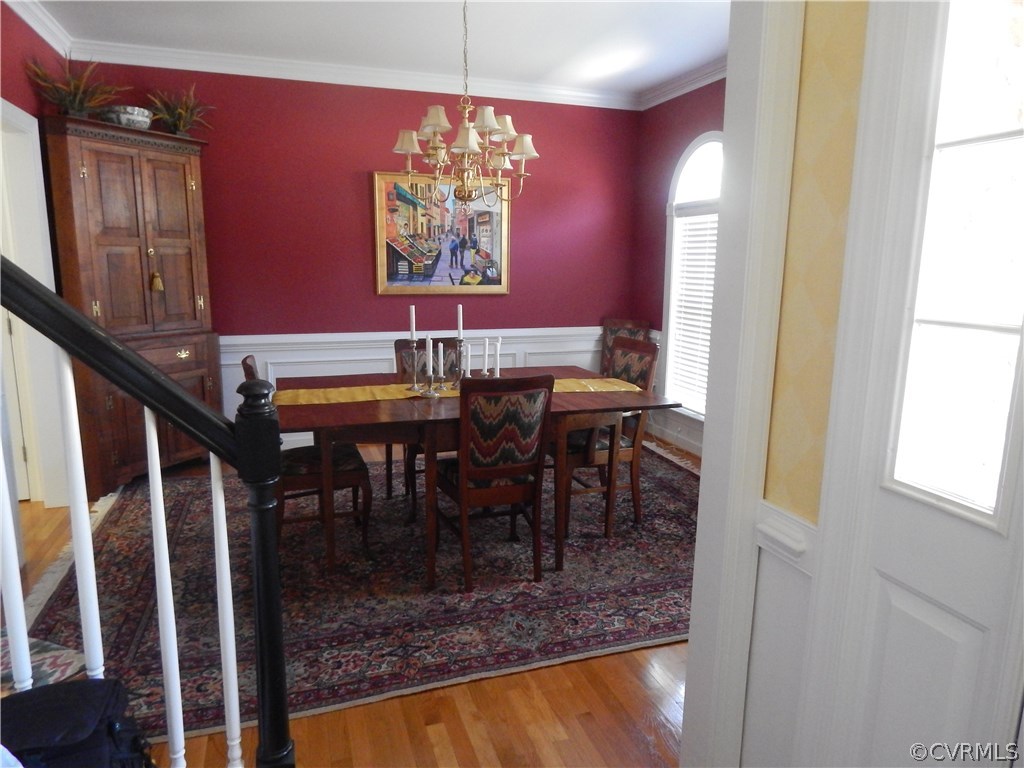 1737 Rolfield Way Henrico, VA 23238 - Photo 3 of 16 a view of a dining room with furniture window and wooden floor