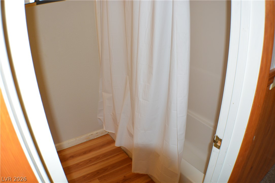 1321 Trout Canyon Road Las Vegas, NV 89124 - Photo 24 of 50 Hardwood-style flooring extends into this convenient, accessible shower space.