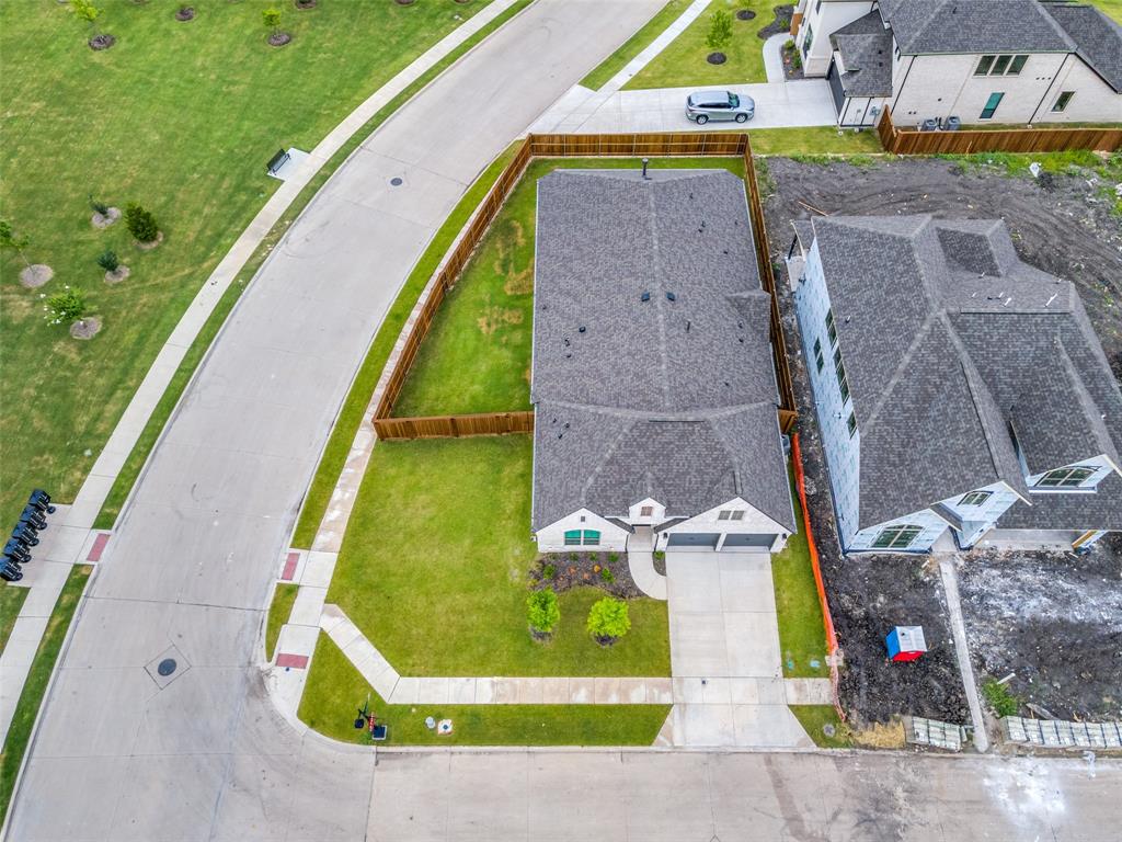 an aerial view of a house with a swimming pool