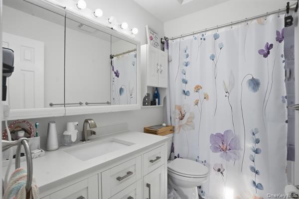 31 Laura Road Monroe, NY 10950 - Photo 25 of 39 a bathroom with a granite countertop sink a toilet and shower