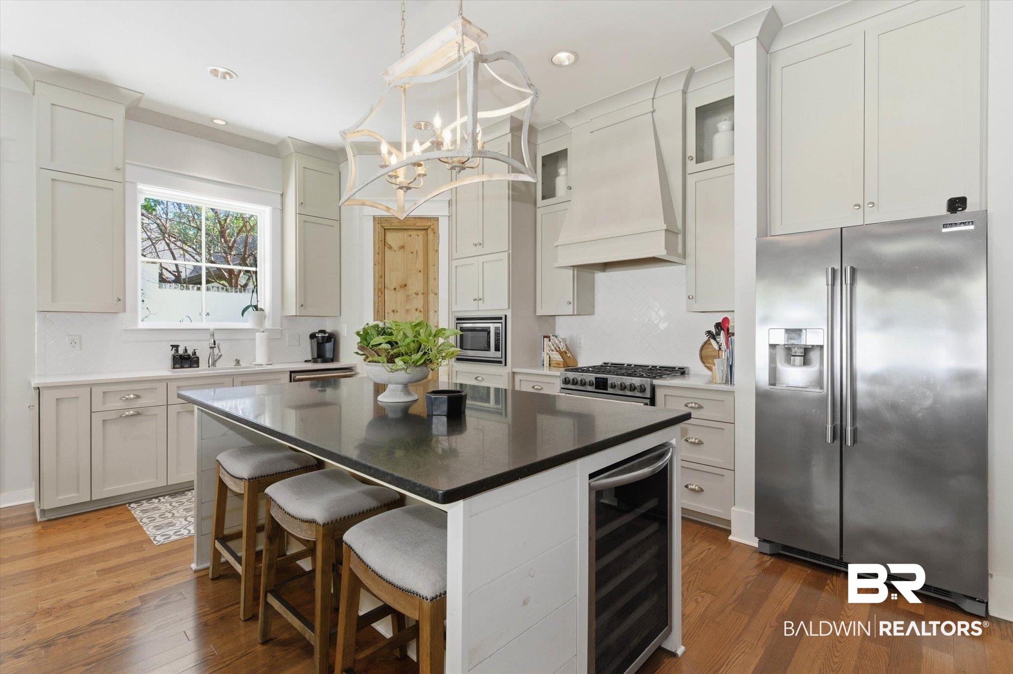 3704 Stein Street Mobile, AL 36608 - Photo 11 of 37 Kitchen with backsplash, stainless steel appliances, a center island, beverage cooler, and recessed lighting