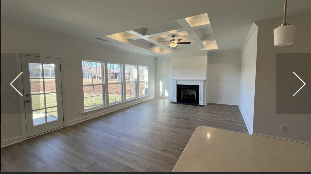 6158 Worthington Road Columbia, TN 38401 - Photo 8 of 48 wooden floor in an empty room with a fireplace