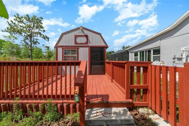 20805 Sheldon Street Orlando, FL 32833 - Photo 1 of 18 a view of a wooden house with a large window