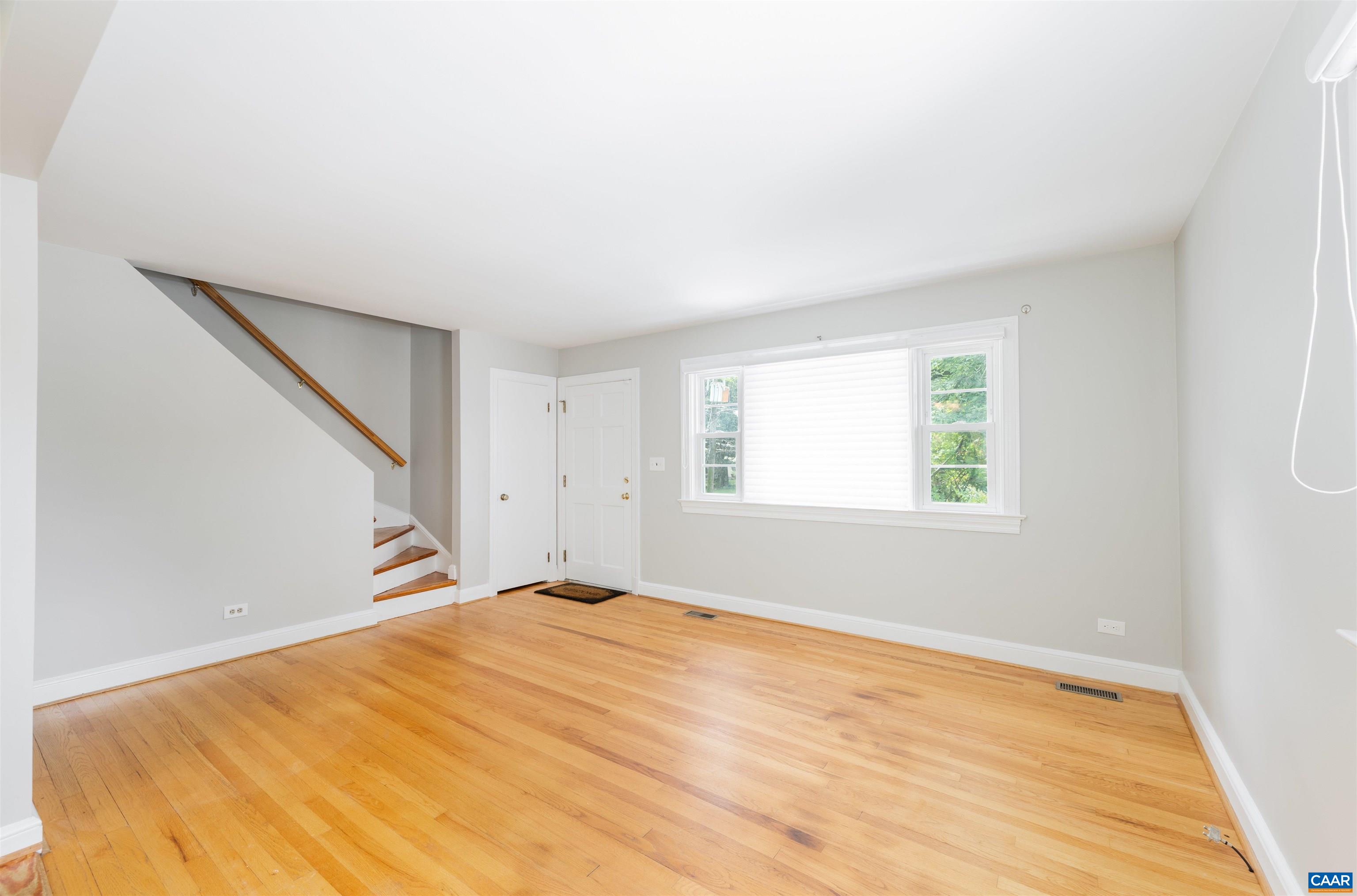 103 Perry Drive Charlottesville, VA 22902 - Photo 11 of 37 a view of empty room with wooden floor and fan