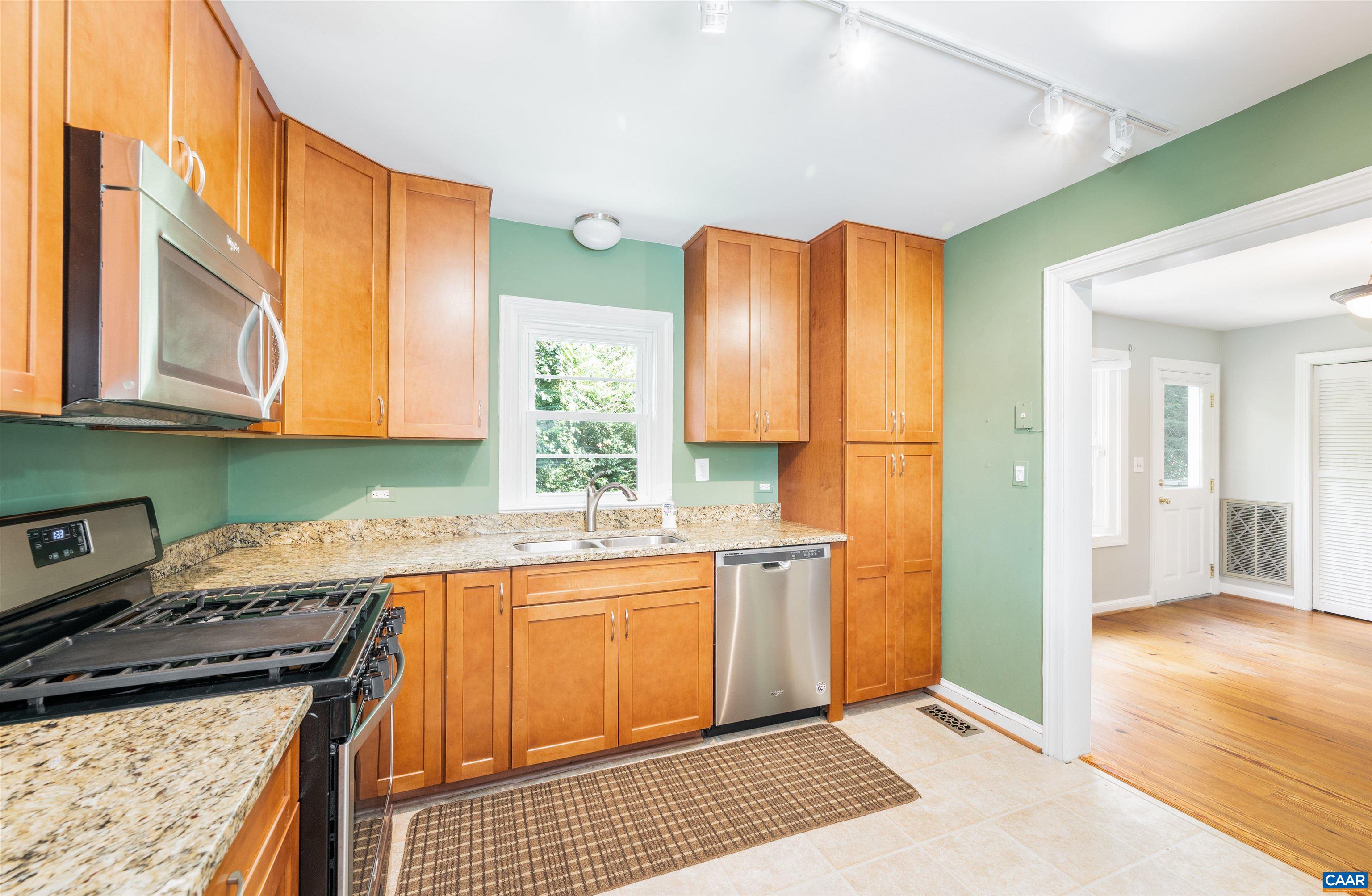 103 Perry Drive Charlottesville, VA 22902 - Photo 13 of 37 a kitchen with a sink stove and cabinets