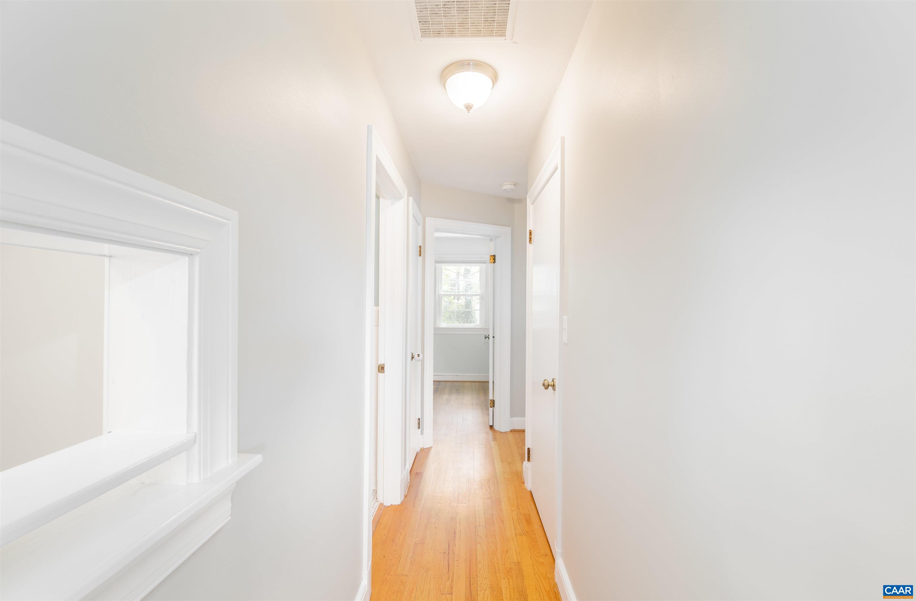 103 Perry Drive Charlottesville, VA 22902 - Photo 16 of 37 a view of a bathroom from a hallway