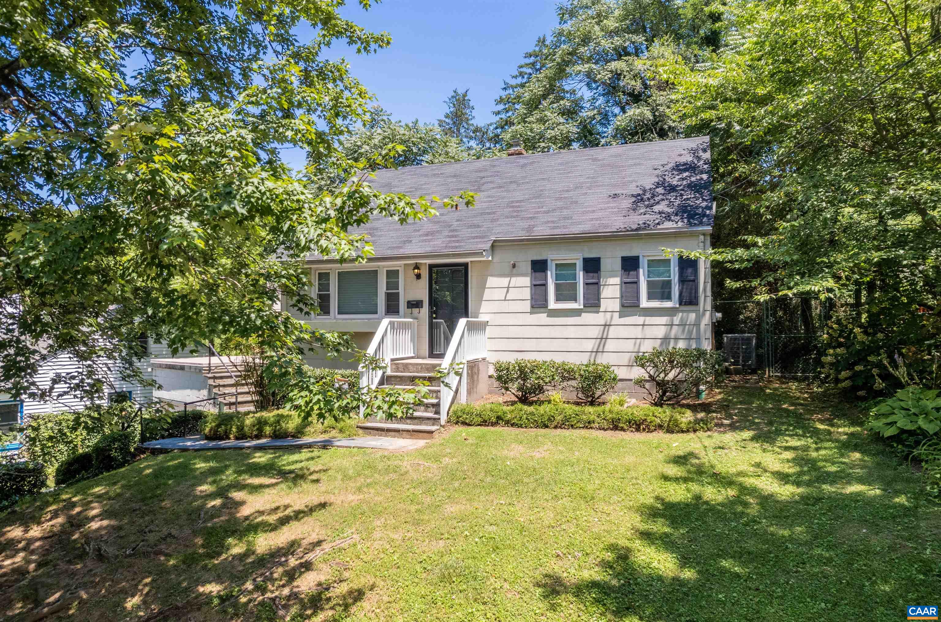 103 Perry Drive Charlottesville, VA 22902 - Photo 27 of 37 a front view of a house with a yard table and chairs
