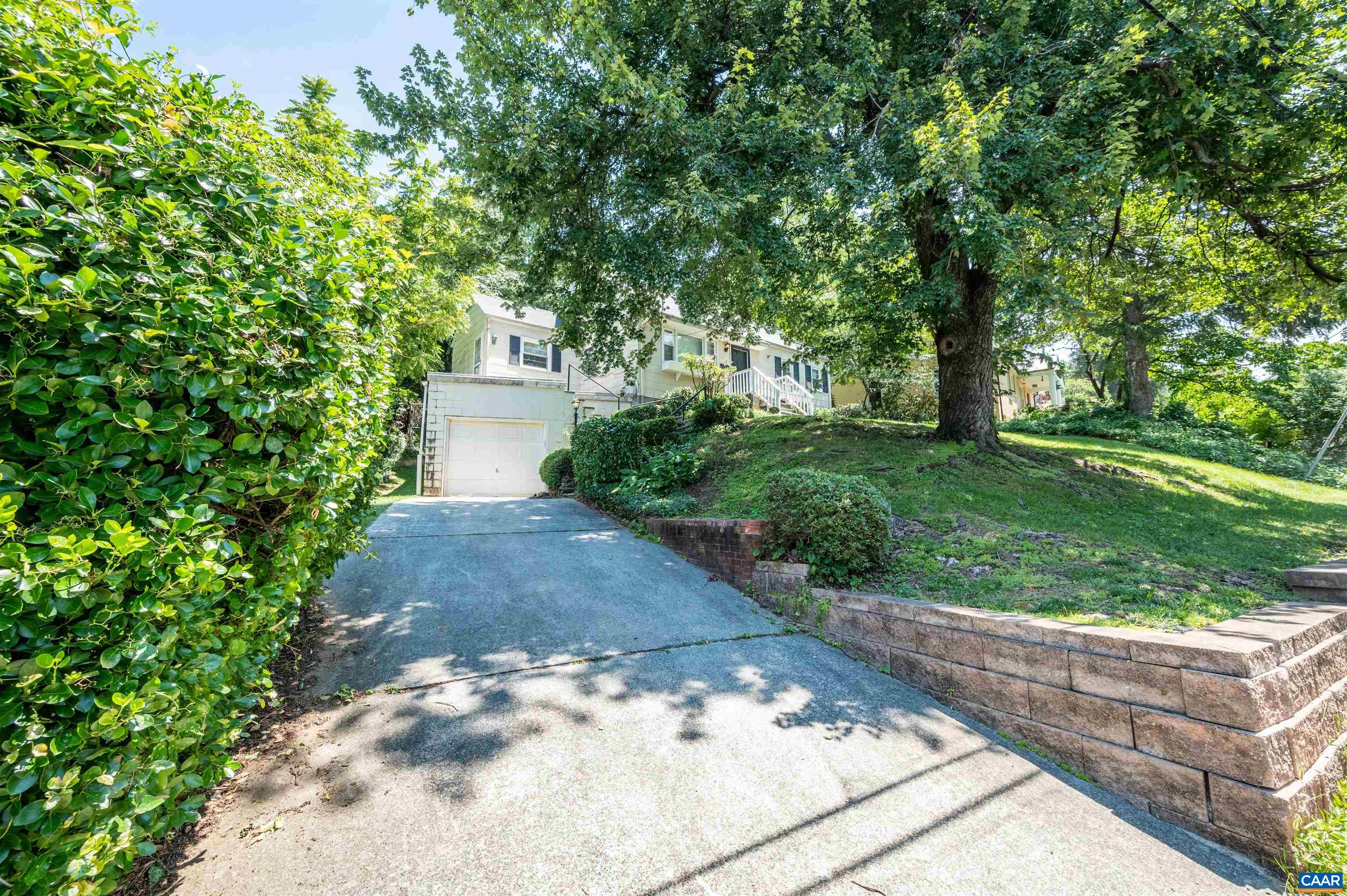 103 Perry Drive Charlottesville, VA 22902 - Photo 36 of 37 a view of a yard with plants and a fountain