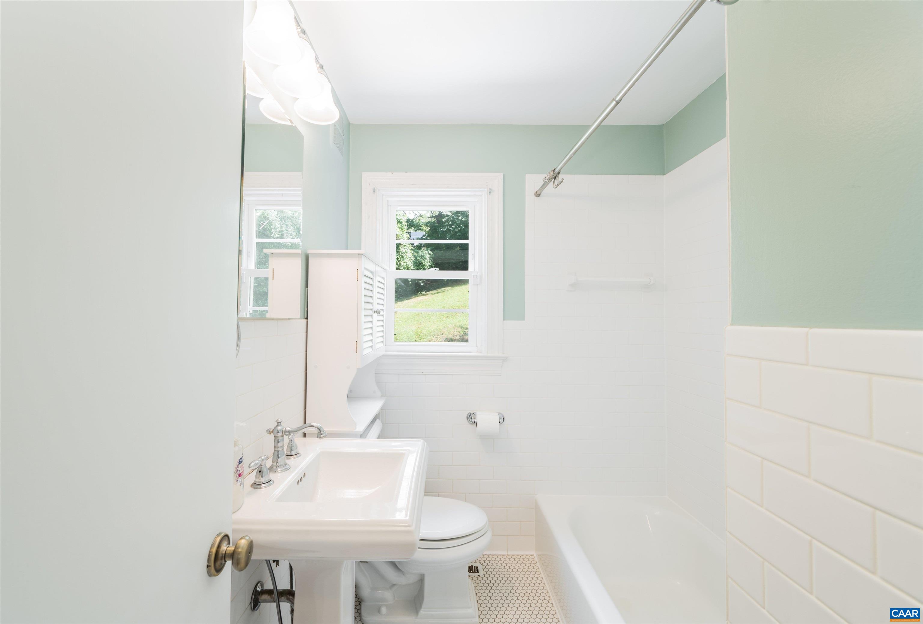 103 Perry Drive Charlottesville, VA 22902 - Photo 5 of 37 a bathroom with a sink and a mirror