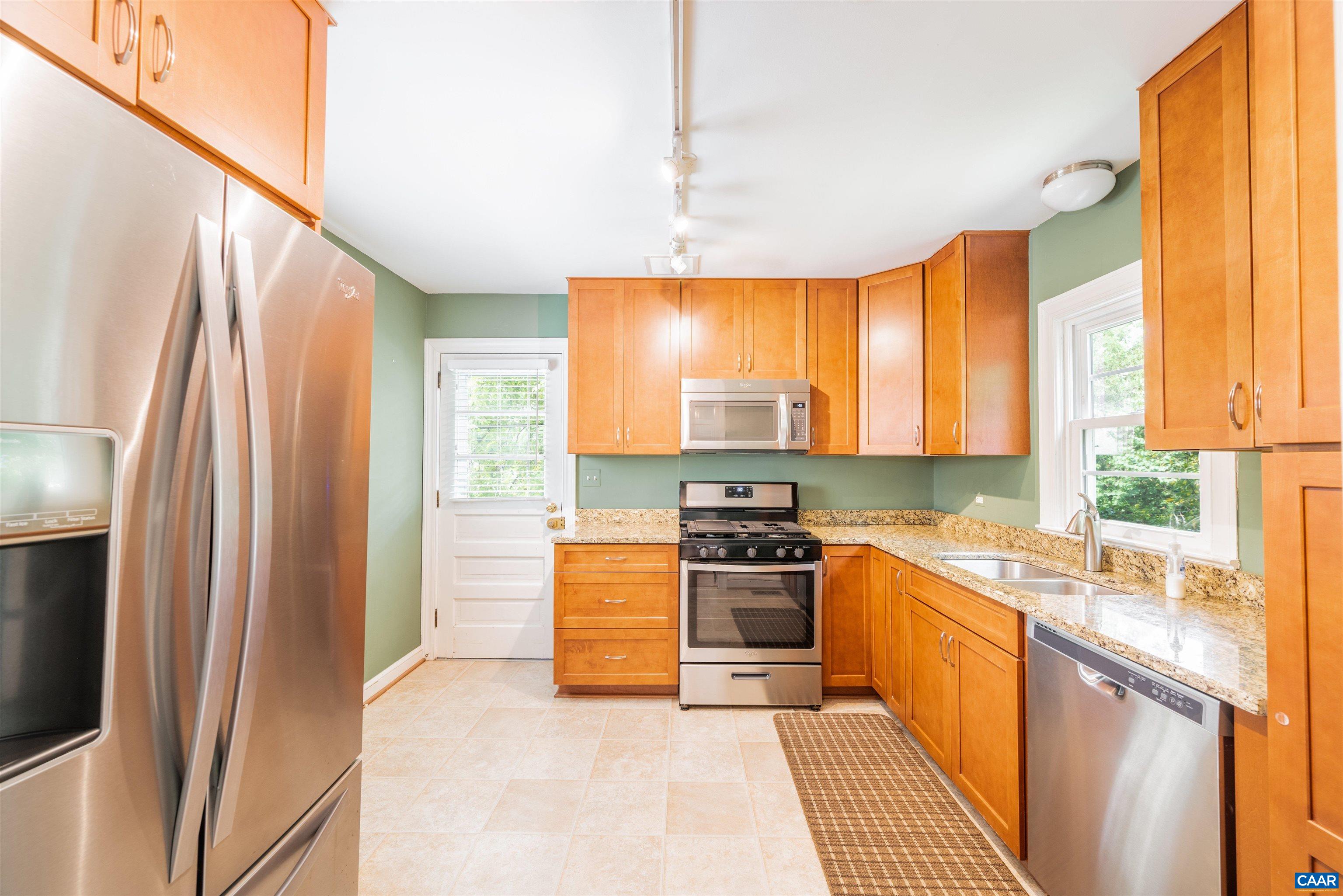103 Perry Drive Charlottesville, VA 22902 - Photo 7 of 37 a kitchen with stainless steel appliances granite countertop a sink a stove and a refrigerator