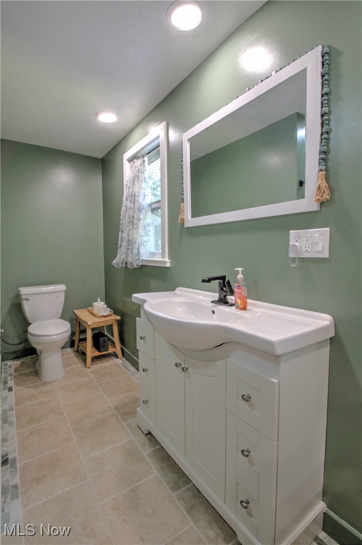 11375 Bean Road Chardon, OH 44024 - Photo 29 of 50 Half bath featuring vanity, light tile patterned floors, and recessed lighting