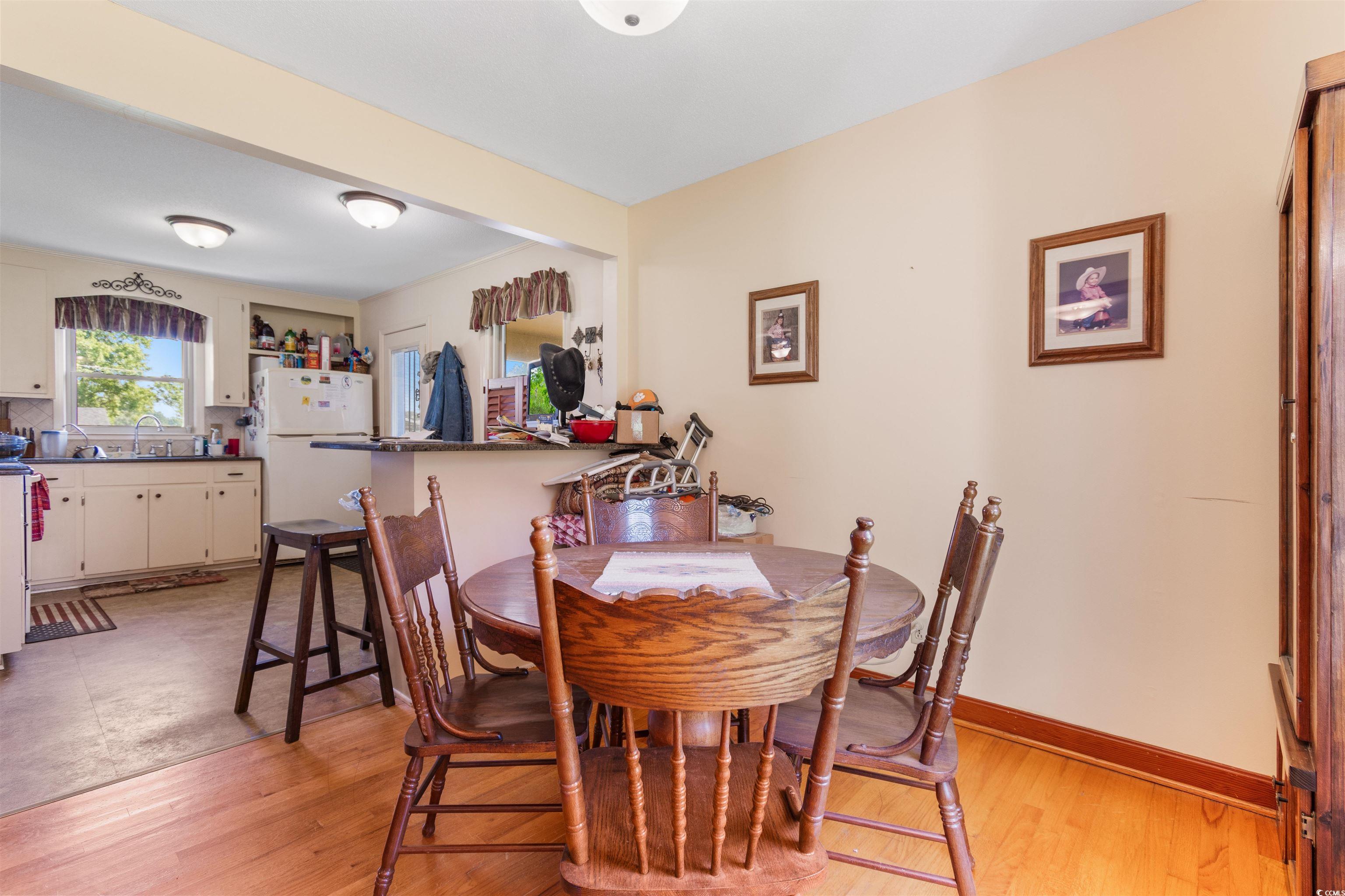 3101 Willow Creek Road Florence, SC 29505 - Photo 18 of 39 Dining area featuring baseboards and light wood-style floors