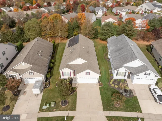 an aerial view of a house with outdoor space