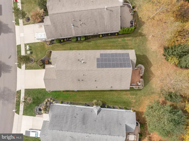an aerial view of a house with a garden