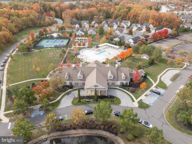 an aerial view of a house with a swimming pool