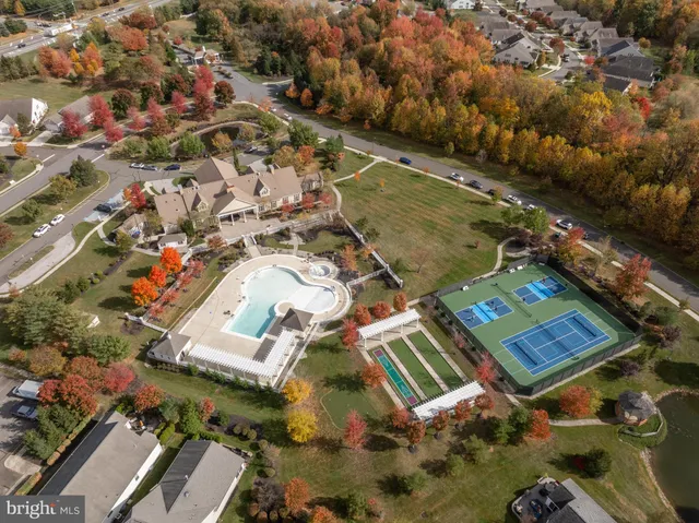 an aerial view of a house with swimming pool and outdoor space
