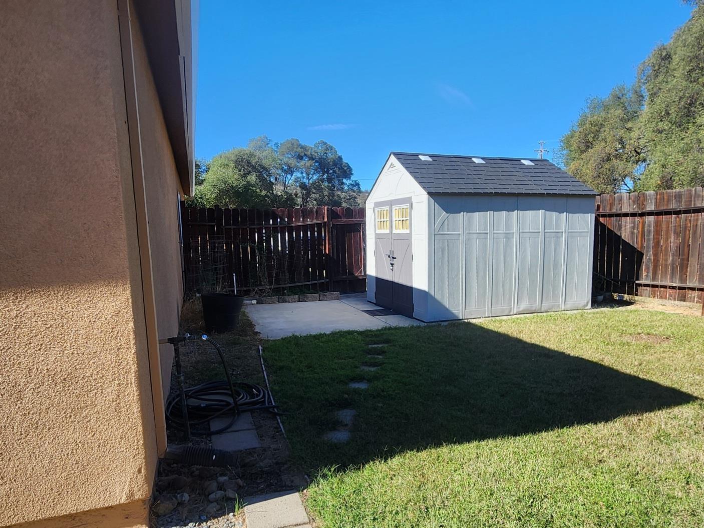 3109 Dunn Road Valley Springs, CA 95252 - Photo 11 of 62 a view of a house with backyard and porch