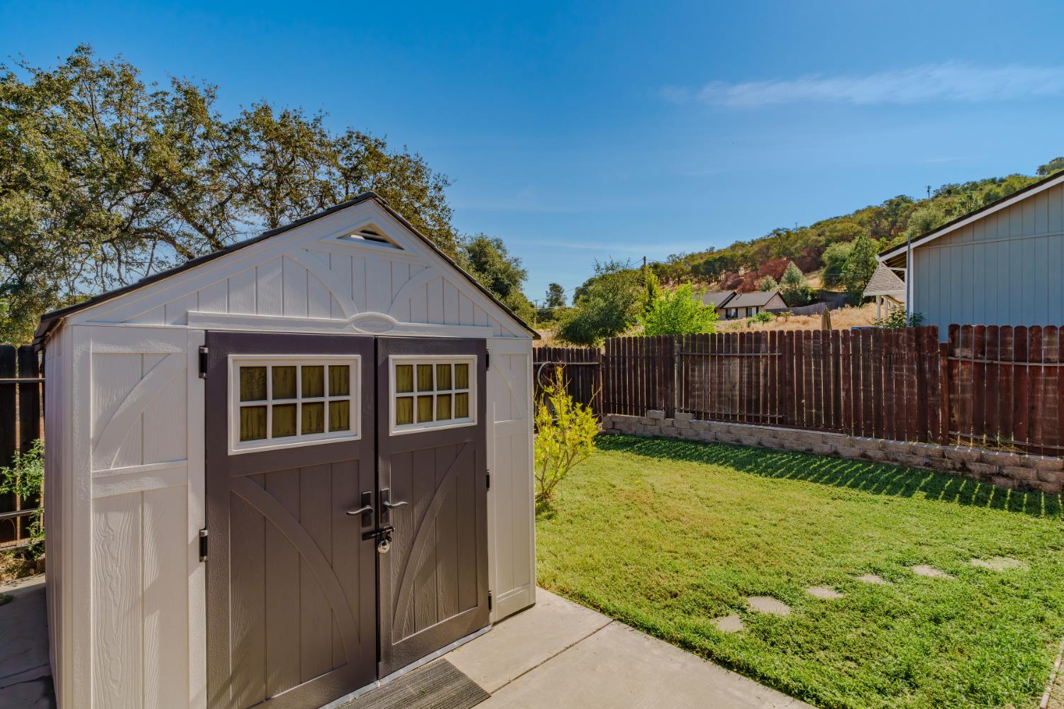 3109 Dunn Road Valley Springs, CA 95252 - Photo 13 of 62 a view of a backyard with wooden fence and a large tree