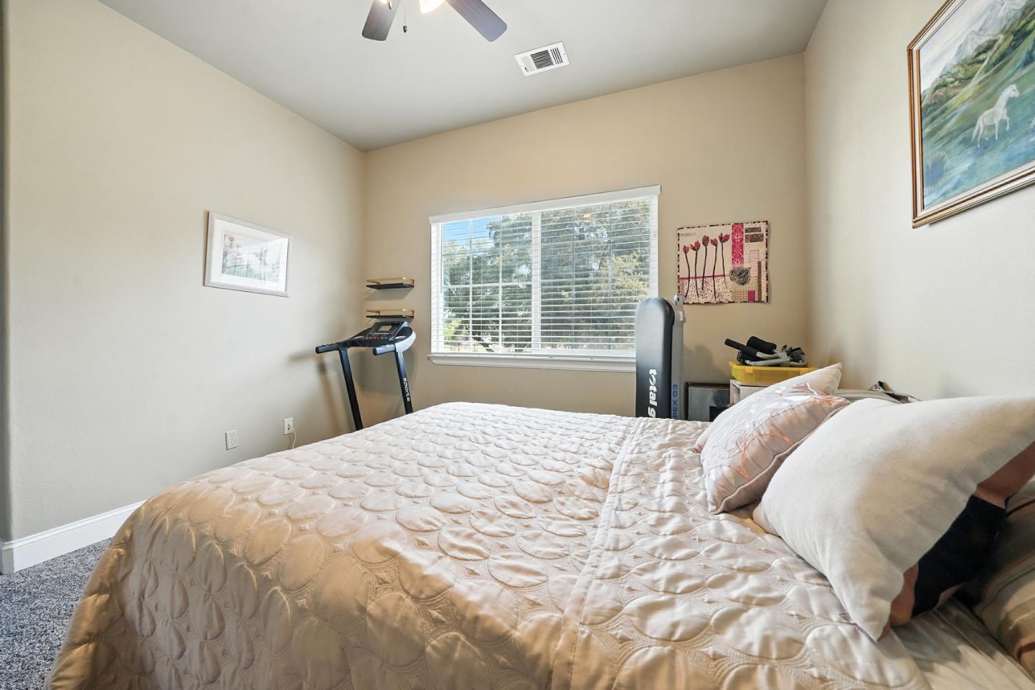 3109 Dunn Road Valley Springs, CA 95252 - Photo 31 of 62 a bedroom with a bed and a dresser next to a window