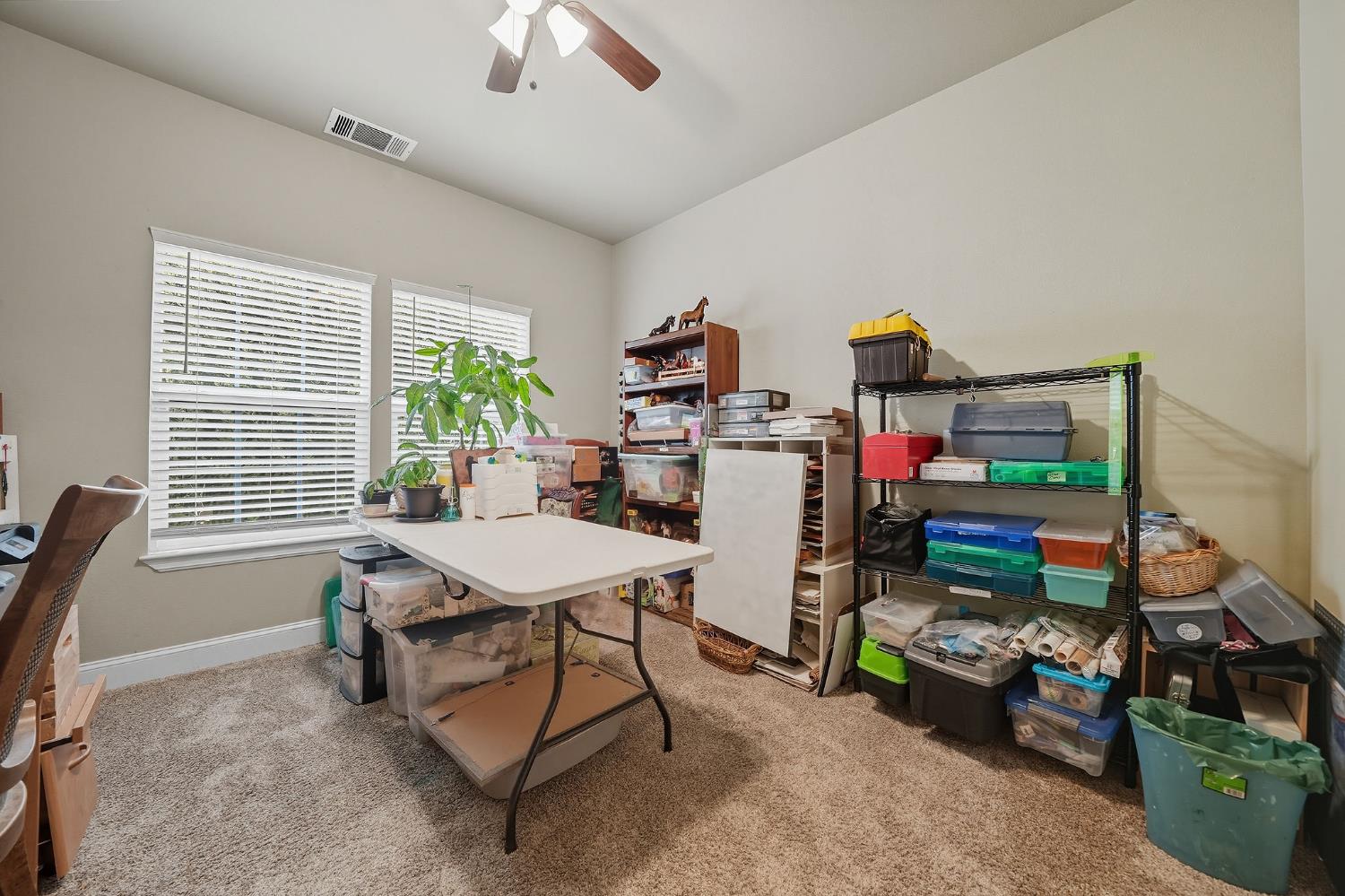 3109 Dunn Road Valley Springs, CA 95252 - Photo 35 of 62 a view of a workspace with furniture and toys in a room