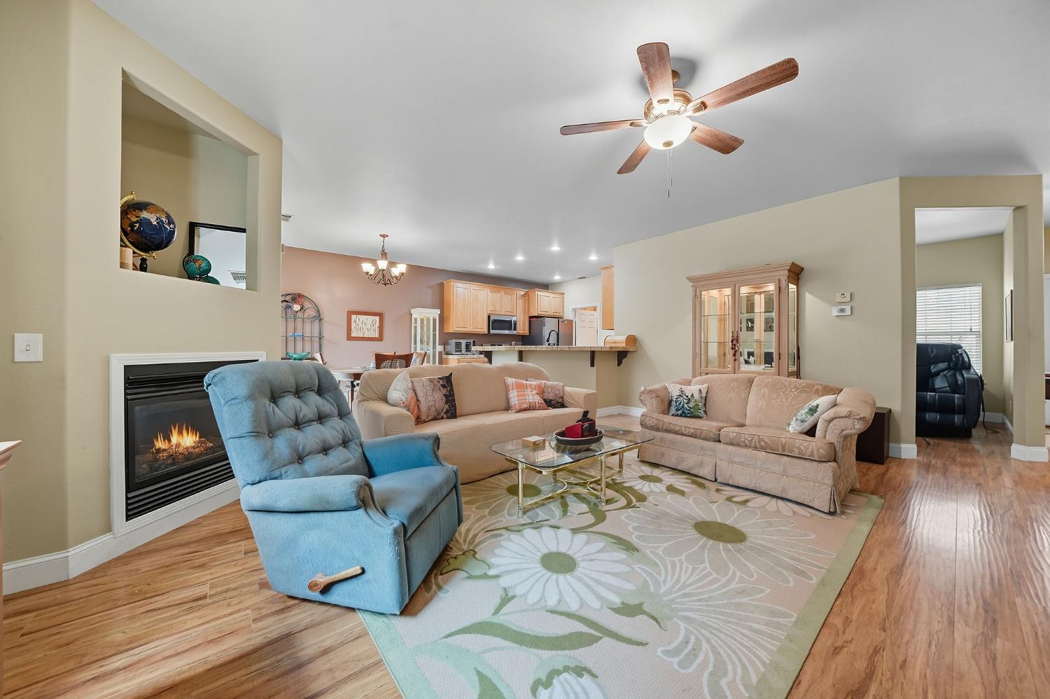 3109 Dunn Road Valley Springs, CA 95252 - Photo 47 of 62 a living room with furniture kitchen view and a wooden floor