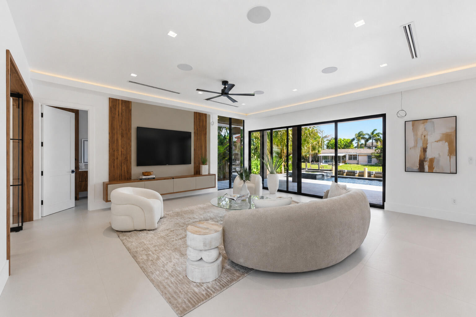 2360 Northeast 49th Street Lighthouse Point, FL 33064 - Photo 16 of 66 a living room with furniture and a flat screen tv