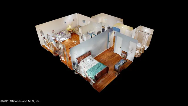 an aerial view of a house with outdoor space and a lake view