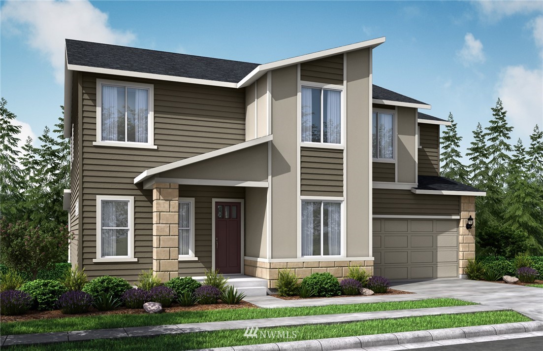 109 215th Street Southeast, Unit 5 Bothell, WA 98021 - Photo 1 of 12 a front view of a house with a yard and garage