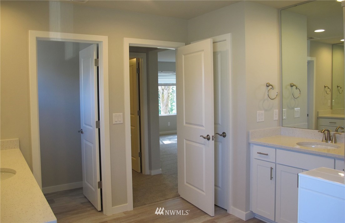 109 215th Street Southeast, Unit 5 Bothell, WA 98021 - Photo 10 of 12 a bathroom with a sink and a mirror
